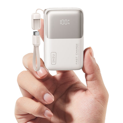 INIU P50 Power Bank, white, USB-C cable, 100% charge display, fast charging power bank in hand.
