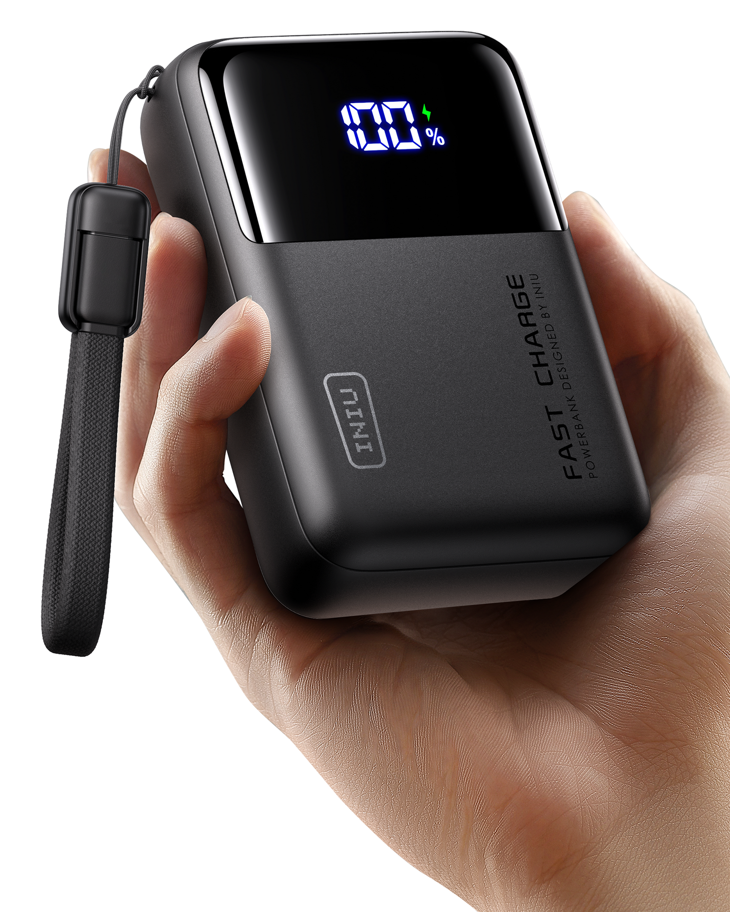 Black power bank with digital display held in a hand on a white background
